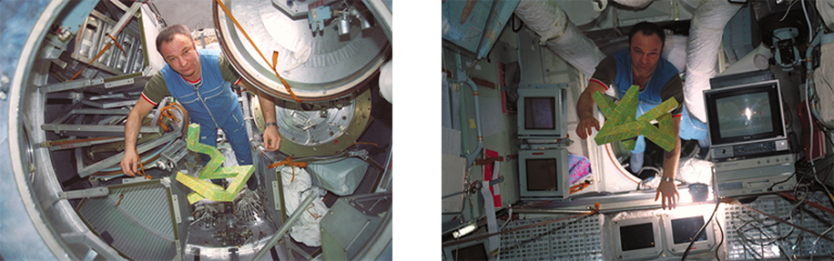 Cosmonaut Gennadi Manakov unpacking the Cosmic Dancer and moving it into the Mir station